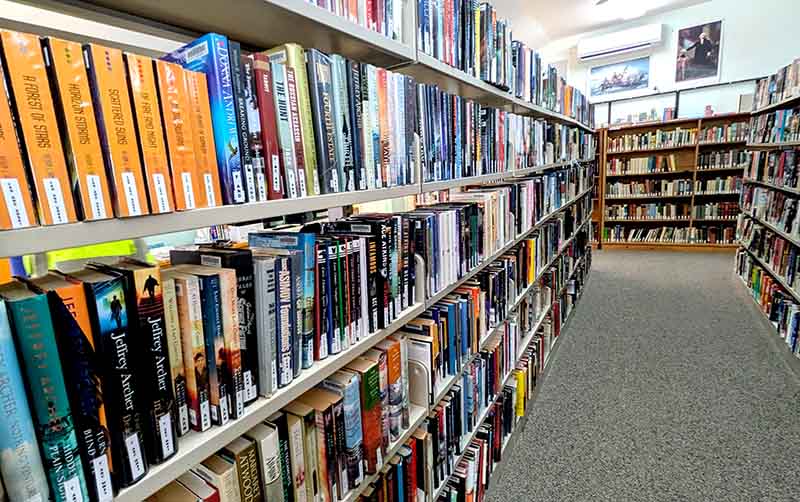 books on shelves at the library in Island Falls Maine