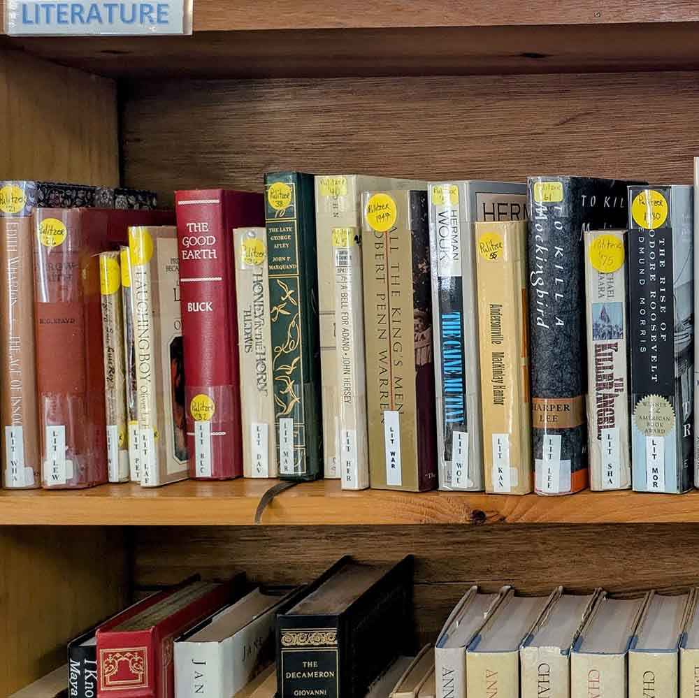 a shelf full of Pulitzer Prize winning books